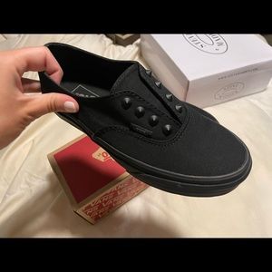 Brand new never been worn black van slip ons.
